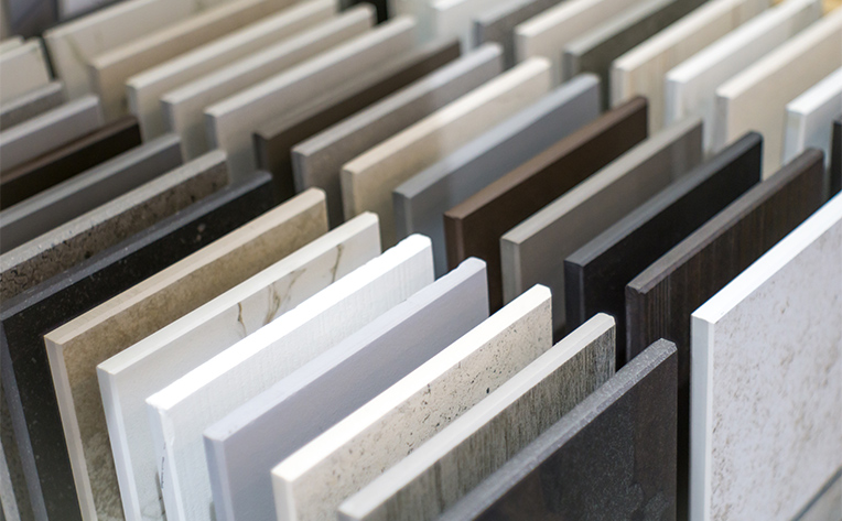 a range of tile samples lined up in display case
